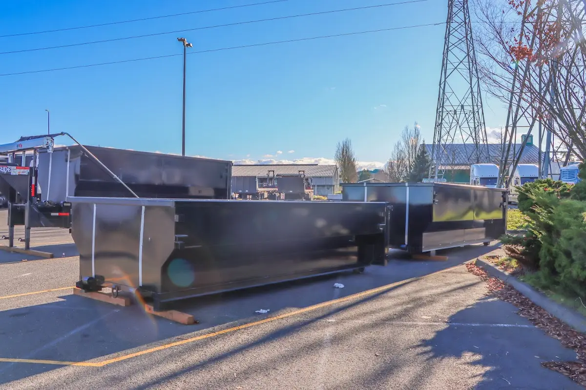 Roll-off dumpster ready for waste disposal at job site for 3 Yard Dumpster Rental in Saks